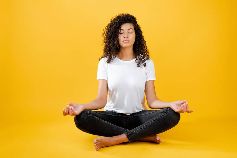 A woman enjoying the spiritual meaning of the color yellow